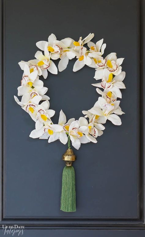 Dress up your front door for spring with a beautiful DIY embroidery hoop wreath using artificial flowers in two easy steps. Find out how at uptodateinteriors.com. #hoopwreath #springwreath Wreath On Wall, Orchid Wreath, Diy Orchids, Embroidery Hoop Wreath, Large Embroidery Hoop, Floral Hoop Wreath, Creative Wreaths, Diy Spring Wreath, Easter Egg Wreath