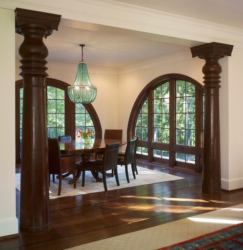 We complemented the dramatic arched windows in this Queen Anne style house with Balinese columns, a perfect blending of style and culture. Houses With Round Windows, Living Room Indian Decor, Queen Room Aesthetic, House Design Indian Style, Kerala Style House, Arch Windows, Arsitektur Kolonial, Indian Houses, Arch Window