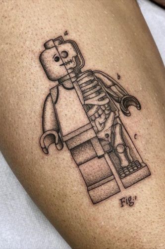 Explore Top 20 Lego-Inspired Tattoos: Creative & Nostalgic Designs for 2024 Lego Man Tattoo, Lego Tattoo, Tattoos Dotwork, Full Neck Tattoos, Anatomy Tattoo, Man Tattoo, Tattoo Parlor, Small Stickers, Lego Man