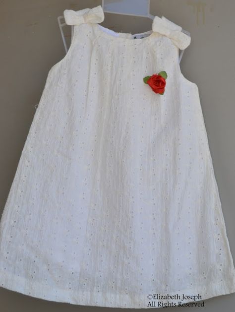 A cute frock for toddlers. White hakoba with pleats around neck and bows on shoulder. Hakoba Dress For Kids, Hakoba Frocks For Kids, White Hakoba Dress, White Frocks For Kids, Hakoba Frock, Hakoba Dress, White Frocks, Cute Frock, Kerala Dress