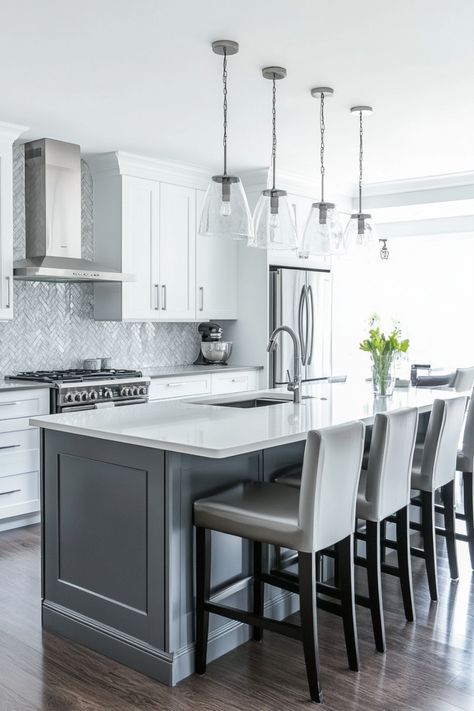 Modern kitchen with a large island, stainless steel appliances, and pendant lighting. White And Gray Kitchen Decor, Grey And White Kitchen Ideas, White Kitchen Decor Ideas, Gray Kitchen Decor, Geometric Tile Backsplash, White And Gray Kitchen, Grey And White Kitchen, White Kitchen Designs, Patterned Window Treatments