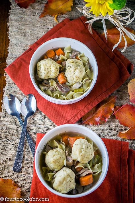 Decorated table set with two bowls of turkey matzo ball soup. Soup Turkey, Matzo Balls, Decorated Table, Matzo Ball, Shredded Turkey, Matzo Ball Soup, Turkey Broth, Matzoh Ball, Thanksgiving Dishes