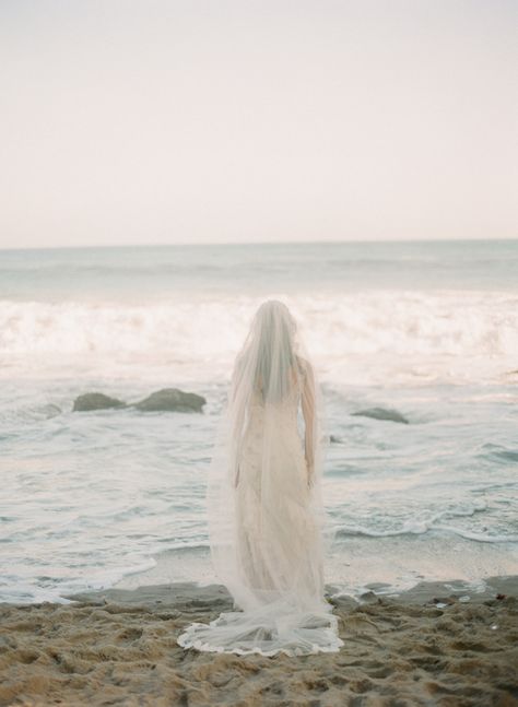 Ethereal beach wedding inspiration | Wedding Sparrow Beach Wedding Dress With Veil, Ocean Inspired Wedding Dress, Ethereal Beach Wedding, Vintage Beach Wedding Aesthetic, Ocean Wedding Pictures, Mermaid Wedding Aesthetic, Ocean Wedding Aesthetic, Beach Bridal Photoshoot, Coastal Wedding Photography