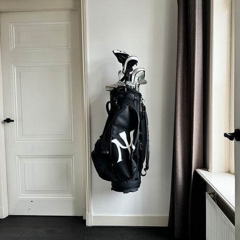 Wall Mount Golf Bag Storage Rack @ SharperImage.com Golf Bag Storage, Golf Storage, Bag Wall, Kids Gadgets, Golf Simulator, Golf Simulators, Black Highlights, Golf Bag, Storage Diy