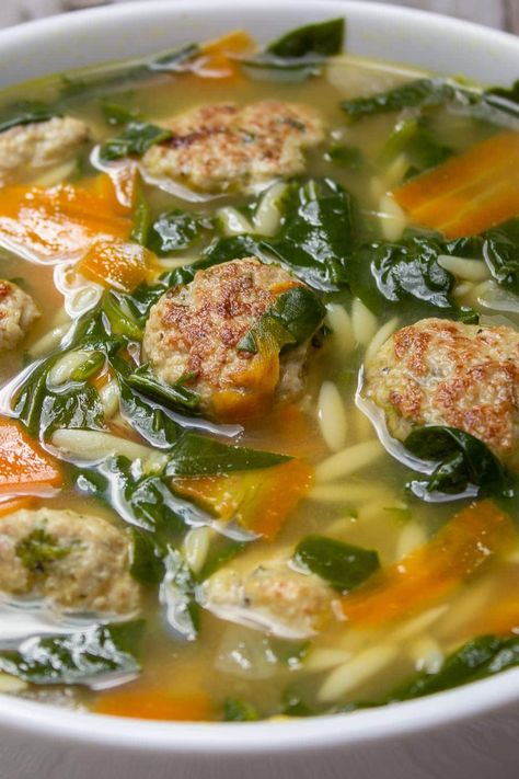 Wedding Soup is a delicious combination of meatballs, orzo, chicken broth and vegetables that comes together for a hearty, comforting meal-in-a-bowl. This one is kicked up with lemon zest. Meals Under 400 Calories, Wedding Soup Recipe, Chicken Meatball Soup, 400 Calorie Meals, Chicken Meatball, Honey Lime Chicken, Orzo Soup, Wedding Soup, Meatball Soup