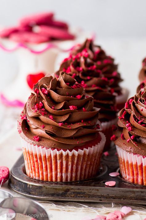 Raspberry & Chocolate Valentine’s Cupcakes (Gluten Free) - Beautiful, delicious and full of heart – these raspberry & chocolate Valentine’s cupcakes are the perfect way to share your love. With moist raspberry cupcakes, a raspberry jam centre, and topped with a luxurious chocolate buttercream frosting. Plus, they’re easy to make! Chocolate cupcakes recipe. Valentines Day desserts. Valentines Day recipes. Gluten free desserts. Gluten free cupcakes. #valentinesday #cupcakes Chocolate Raspberry Buttercream, Raspberry Buttercream Frosting, Chocolate Raspberry Cupcakes, Chocolate Valentine, Valentine Cupcakes, Luxurious Chocolate, Best Cupcakes, Raspberry Cupcakes, Raspberry Buttercream