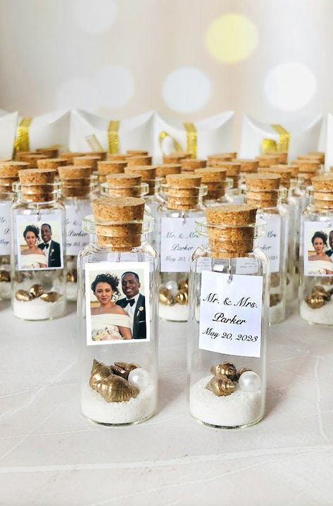 White Wedding Favors for Guests, Custom Photo Favors for Nautical party, Save our date guests gifts, Personalized beach in a bottle favors #photoweddingfavors #favorsforguests #whiteweddingtheme #personalizedfavors #customphotofavors #wedding #etsy Gift Idea For Wedding Guests, Mini Bottle Wedding Favors, Wedding Souvenir Ideas For Guests, Wedding Souviner, Beach In A Bottle, Silver Wedding Favors, Unusual Wedding Gifts, Eco Friendly Wedding Favors, Memorable Wedding Favors