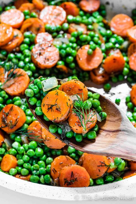 Classic peas and carrots are upgraded in this easy, flavorful, and full-of-texture side dish recipe. Carrots and peas are sautéed until tender and then stirred with butter and topped with fresh dill. It's an easy peasy side dish for weeknight dinners or special occasions. And it's ready in 20 minutes! #theendlessmeal #peasandcarrots #carrotsandpeas #carrots #peas #sidedish #easyside #dinner Carrots Recipe Healthy, Recipe Carrots, Peas And Carrots Recipe, Easy Vegetarian Sides, Roasted Baby Carrots, Carrots Side Dish, Honey Roasted Carrots, Peas And Carrots, Vegetarian Sides