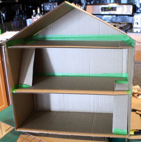 Connecting the roof with frog tape, Cardboard Box Toy Doll House by Little Red Window Cardboard Box Houses, Diy Cardboard Toys, Cardboard Dollhouse, Diy Barbie House, Cardboard Toys, Doll House Plans, Cardboard House, Toy House, Barbie Doll House