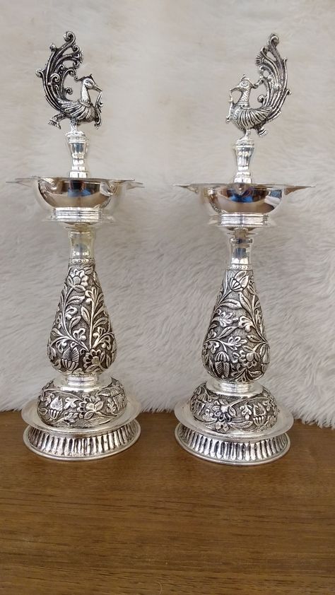 Mahalaxmi gold and diamond merchants 92.5 Silver Antique peacock 🦚 kuthu vilakku Grams - 958.570 Worldwide shipping available Customer care number - 9283 916 916 Silver Deepam Design, Silver Deepam, Silver Lamps, Silver Home Accessories, Silver Articles, Emerald Stone Rings, Golden Sparkle, Pooja Items, Pooja Mandir