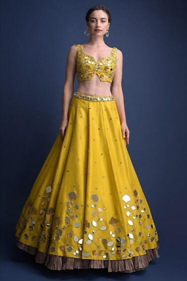 Top Bridal Lehenga Designs | Latest Designer Lehengas for Wedding | Visit BookEventz.com for more!! #lehenga #saree #fashion #lehengacholi #indianwedding #indianwear #wedding #ethnicwear #indianfashion #indianbride #onlineshopping #bridallehenga #kurti #weddingdress #lehengalove #bridalwear #designer #designerlehenga #lehengas #bridal #weddinglehenga #anarkali #bride #instafashion #love #style #traditional #sarees #india #redlehenga #dreamwedding #designerpiece #designerdress Work Lehenga Designs, Yellow Lehenga Choli, Haldi Dress, Mirror Work Lehenga, Sunset Yellow, Simple Lehenga, Mehendi Outfits, Indian Outfits Lehenga, Yellow Lehenga