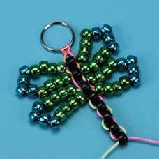 Weave pony beads in a pattern to create a dragonfly bead pet Pony Bead Crafts For Kids, Bead Craft Ideas, Bead Dragonfly, Bead Pets, Melted Pony Beads, Pet Craft, Pony Bead Animals, Keychains Diy, Camp Projects