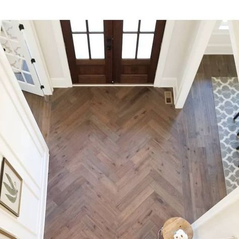 Shannon Homes Design Build on Instagram: "Way to make an entrance! Love how this herringbone foyer floor turned out! 😍 [#eloiseandparo #interiordesigner #interiordesign #residentialdesign #homedecor #homedesignideas #designinspo #herringbone #hardwoodfloors #details #freshclassic #notboring #interiorstylist #interiordesignideas #newconstruction #millwork #naturallight #foyerdecor #frontdoor #pattern ]" Entry Tile Floor Entryway Herringbone, Herringbone Wood Floor Entryway, Herringbone Tile Floor Entryway, Herringbone Foyer, Chevron Entryway, Lvp Herringbone, Herringbone Wood Tile Floor, Herringbone Entryway, Foyer Floors