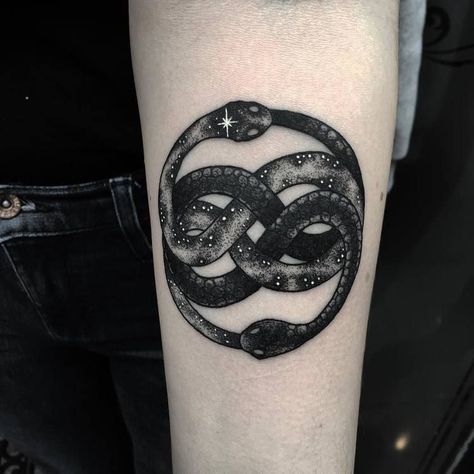 Black tattoo of an Ouroboros snake inked on the left arm Eightball Tattoo, Story Tattoo, Ouroboros Tattoo, Dark Tattoos, Never Ending Story, Mark Tattoo, Dandelion Tattoo, Feather Tattoo Design, Owl Tattoo Design