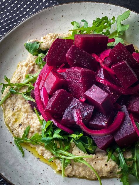 Contrasting pickled beet salad with a lemony chickpea mash, the combination delivers zest and comfort in one bite. Perfect for a light lunch or to share with your friends. Pickled Beets Salad, Pickled Beet Salad, Beets Salad, Chickpea Mash, Beetroot Carpaccio, Creamy Chickpea, Pickled Beets Recipe, Beetroot Recipes, Satisfying Salads