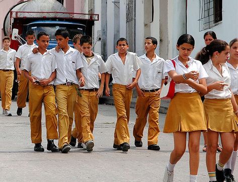 Education: All students are required to wear a school uniform, regardless of age or gender. These uniforms are required by color to what grade you are in. Children are able to choose between pre-university education or technical and professional education. Mexican School Uniforms, Cuba Aesthetic, Mixed Boys Haircuts, Catholic School Uniforms, Mixed Boys, Cuba Photography, Jose Marti, Cuban Culture, High School Uniform