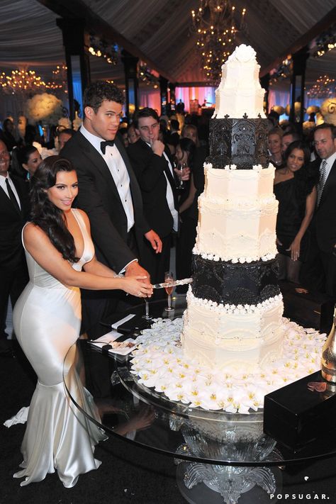 Pin for Later: Before Kim Marries Kanye, Take a Look Back at That Other Wedding She Had  They cut their enormous wedding cake. Kim Kardashian Kris Humphries, Congolese Women, Tall Wedding Cakes, Kardashian Wedding, Kim Kardashian Wedding, Fancy Wedding Cakes, Royal Wedding Cake, Wedding Cake Photos, Kim And Kanye