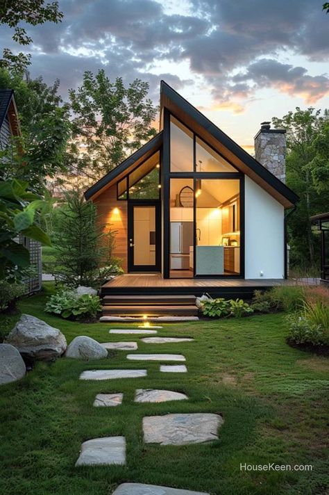 Embark on a journey through an ingenious triangular micro-home, where small is the new spacious. Discover the art of maximizing every inch in a small triangular house, where innovation thrives. Click the article for more ideas! Minimal House Ideas, Glamping House Ideas, Airbnb House Ideas, House With Round Windows, Mobile House Ideas, Small House Windows, A Frame Tiny House, Small Airbnb, Small Cabin Homes