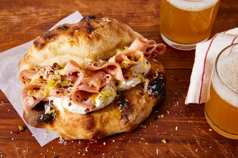 In this recipe, which is directly inspired by La Mortazza, a dish at Evan Funke’s LA restaurant Mother Wolf, a round of Neapolitan-style pizza dough is folded over onto itself before being baked, creating a stuffable pocket for mortadella and burrata. Bake this pizza sandwich as a fun alternative to regular pizza. Evan Funke, Pizza Sandwich Recipe, King Arthur Baking, Pizza Sandwich, Burrata Cheese, Baking Stone, Fresh Cheese, Minced Meat, Dough Balls