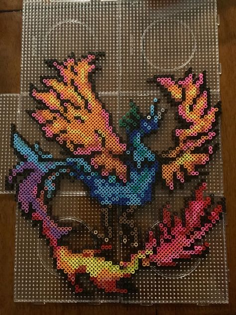 Fuse bead pattern of a phoenix, Perler beads Wings Perler Beads, Phoenix Perler Bead Patterns, Hummingbird Perler Beads, Phoenix Pixel Art, Monster Hunter Perler Beads, Ideas Regalos, Perler Ideas, Fuse Bead Patterns, Beads Designs