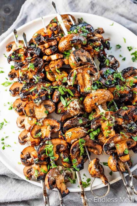 These grilled mushrooms are a flavorful and endlessly versatile side dish for any season. They're marinated in balsamic vinegar, soy sauce, and garlic and then grilled and drizzled with garlic butter. They're easy to make with a few pantry ingredients, and they're ready in just 20 minutes! #theendlessmeal #grilledmushrooms #mushrooms #garlicbutter #garlicmushrooms #bbqmushrooms #bbq #grill #summer #summerrecipes #sidedish #bbqrecipes #grillrecipes #mushroomrecipes #vegetarian Mushroom Grill Recipes, Mushrooms On Grill, Bbq Mushrooms, Garlic Butter Mushrooms, Summer Bbq Recipes, Marinated Mushrooms, Pantry Ingredients, Grilled Mushrooms, How To Cook Mushrooms