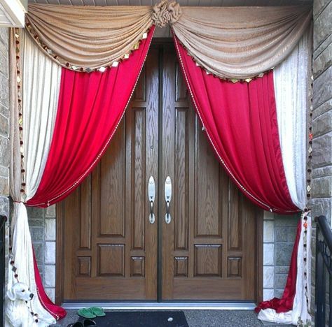 Maharani House Decor Front Door Draping Backdrop in Red and Gold Wedding decor available @idesignevents Punjabi Wedding House Decor, Draping Backdrop, Above Door Decor, Wedding Door Decorations, Outside House Decor, Front Entry Decor, Front Entrance Decor, Entrance Door Decor, Wedding Reception Entrance