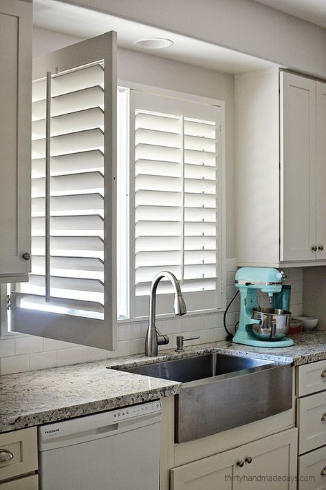 Shutters on window over kitchen sink with one panel open Kitchen Window Treatments Ideas, Window Shutters Indoor, Shutters Indoor, Kitchen Window Coverings, Kitchen Shutters, Window Treatments Ideas, White Shutters, Interior Window Shutters, Kitchen Window Curtains