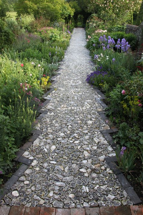 The flint walkway is finished at my brother's farm! This was done completely by hand (from splitting flint stones to the edging and placing of the stones). Cannot wait to see them in person.. Flint Garden, Flint Stones, Stone Edging, Flint Stone, York Stone, Garden Steps, Garden Area, Stone Path, Gallon Of Water