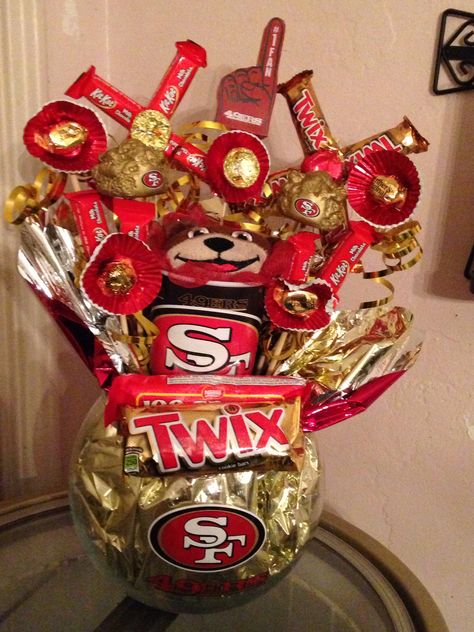 49ers Candy bouquet made of candy and things found at Walmart Diy 49ers Party Decorations, Diy 49ers Gifts Ideas, 49ers Valentine Boxes, 49ers Themed Snacks, 49ers Gifts For Him, 49ers Birthday Party Decorations, 49er Party Ideas, 49ers Party Decorations, 49ers Party Ideas