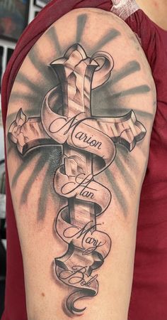 Cool Cross Tattoos, Scroll Tattoo, Best Star Tattoos, Cross With Wings Tattoo, Family Name Tattoos, Cross Tattoo Ideas, Scroll Tattoos, Unique Cross Tattoos, Family Tattoos For Men