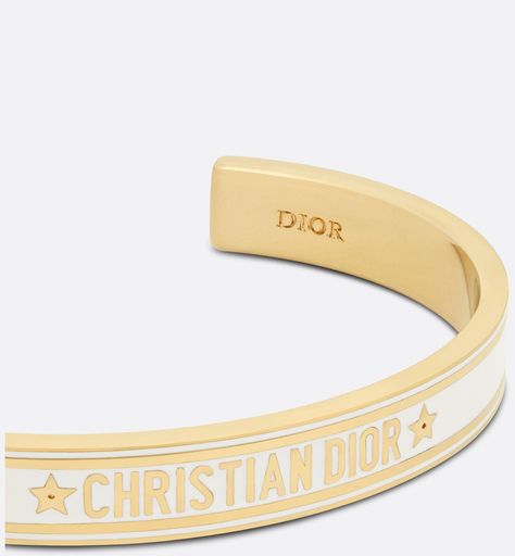 The Dior Code bangle offers a modern and iconic aesthetic. The rigid gold-finish metal design features a Christian Dior signature enhanced by white lacquer. The bracelet may be worn with other Dior Code creations.. Dior Bangle, Christian Dior Bracelet, Dior Bracelet, Iconic Aesthetic, Dior Watch, Dior Star, Icon Shoes, Dior Book Tote, Dior Jewelry