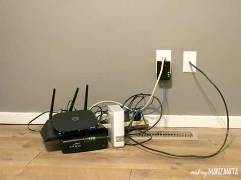 Cords are a huge eye sore, right? If you’re looking for a simple way to hide cords, this one’s for you. Here’s how to hide router cords with a mid-century side table. There is nothing more hideous than a huge pile of cords in a beautifully decorated room. You spend all of your time and ... Read More about  How To Hide Router Cords With A Mid-Century Side Table Hiding Internet Modem Living Rooms, Ways To Hide Internet Router, Diy Hide Tv Cords, Electrical Cord Covers, Hide Electrical Cords, Hide Tv Cords, Router Box, Hide Router, Hide Tv Cables