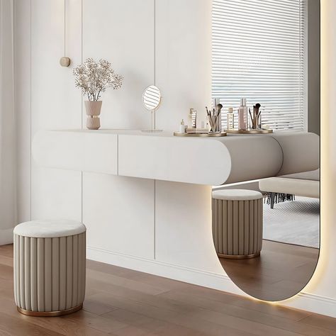 Transform your daily routine into a luxurious experience with our modern dressing table set. This sleek ensemble includes a wall-hung vanity, complemented by a generously-sized mirror for flawless grooming. Organise your essentials effortlessly with ample storage space for cosmetics, jewellery, and accessories. Crafted Modern Dressing Table Designs Luxury, Semi Circle Mirror, Mirror Makeup Table, Modern Dressing Table Designs, Beautiful Bed Designs, Dressing Design, Modern Organization, Modern Minimalist Bedroom, Dressing Table Design