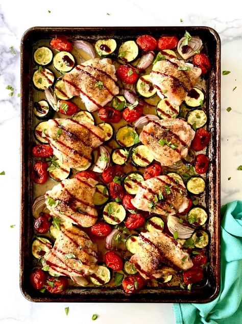 This easy Sheet Pan Chicken and Zucchini is a fast, healthy dinner! Seasoned, juicy chicken thighs, zucchini, cherry tomatoes and shallots are all roasted together, then drizzled with balsamic glaze and fresh herbs. It's quick and simple to prepare and is a great way to use up summer produce. And this healthy baked chicken recipe is gluten-free, dairy-free, low carb, keto, Paleo and Whole30 friendly. Sheet Pan Zucchini, One Pan Chicken And Zucchini, Sheet Pan Chicken And Zucchini, Balsamic Chicken And Zucchini, Chicken Thigh And Veggie Sheet Pan, Potato Tomato Recipe, Chicken Zucchini Potato Sheet Pan, Chicken Zucchini Bake, Cinnamon Chicken