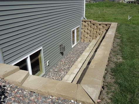 Terraced Windows for the lower level/basement of the home let's more light in and makes the lower level/basement feel more like a lower level/basement with daylight windows. Egress Window Landscaping, Basement Remodeling Before And After, Egress Window Well, Basement Window Well, Daylight Basement, Basement Entrance, Minecraft Basement, Basement Waterproofing, Egress Window