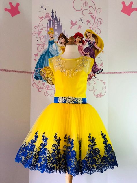 Flower yellow and blue sparkly cocktail interview girls dress. Bodice and waist are decorated with lace applique and gems. 2 colors multi layered skirt. Zipper and lacing back. There is a cutout on the back and a blue bow on the belt. Colors: Yellow Blue. Size 8 ( chest 28.5-29 waist 26.5-27 length from shoulder to hem 32 ). Can be made any size. Yellow And Blue Dress Outfit, Yellow Dress For Kids, Mideval Dress, Princess Dress Short, Prom Dresses Short Blue, Yellow Flower Girl Dresses, Hot Pink Cocktail Dress, Dress With Crystals, Blue And Yellow Dress