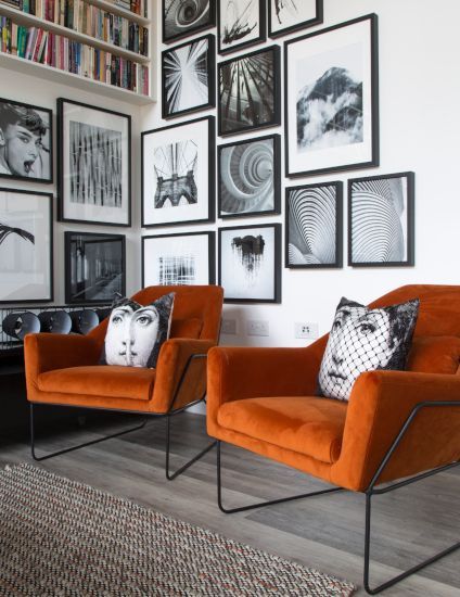 Ever wondered what single colour would liven up the entire downstairs of your home unlike no other? An orange living room is the secret ingredient for bringing a surge of confidence & dynamism to your decor.   Orange Vintage - Fashion, Home, Cars, Interiors and Nostalgia For Kate Beavis #orangevintagefashion #orangevintagehome #orangevintageinteriors #orangevintagenostalgia #orangevintagecars #orangevintagelifestyle #orangevintagelife #orangevintage Orange Black And White Bedroom, White Walls Grey Furniture Living Room, Black And White Armchair, Office With Orange Accents, Orange And Black Interior, Orange Armchair Living Room, Burnt Orange Armchair, Black And Orange Decor, Show Home Living Room