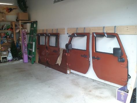 Jeep Garage Storage, Jeep Garage Ideas, Bronco Door Storage, Diy Jeep Door Holder, Jeep Door Storage Diy, Jeep Door Storage, Jeep Door Hanger, Jeep Wrangler Doors, Garage Hacks