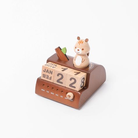 Introducing our Wooden Squirrel Perpetual Calendar Music Box - a charming blend of functionality and whimsy that's sure to delight animal lovers, students, and anyone seeking a touch of joy in their daily routine. Crafted with care and precision, this wooden treasure serves not only as a perpetual calendar but also as a music box that brings a smile with just three turns of the adorable squirrel. ✔ Packaged Size: 2.9 X 2.9 X 3.9 inches ✔ Material: Sustainably-sourced timber ✔ Movement: Turn char Clay Calendar, Ceramic Calendar, Wooden Squirrel, Easy Clay Sculptures, Newspaper Crafts Diy, Emprendimiento Ideas, Wooden Calendar, Clay Diy Projects, Newspaper Crafts