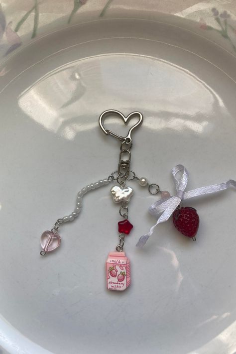 Handmade strawberry bead milk keychain, cute handmade bow keychain, shortcake keyring, handbag strawberry charm silver heart-shaped clasp with a small white bow above the strawberry each keychain is unique made with high-quality glass, lampwork, pearl, and seed beads Milk Keychain, Bow Keychain, Strawberry Charm, Edgy Jewelry, Glass Lampwork, Keychain Cute, Strawberry Milk, Heart Keychain, Beaded Keychains