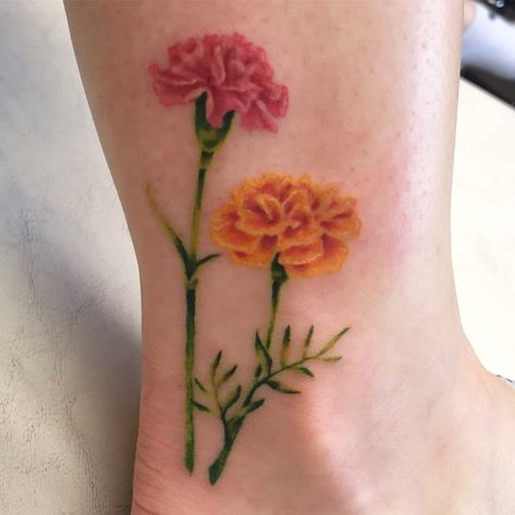 Carnation is my birth flower, marigold is my fiancé’s birth flower. We have known each other since we were in first grade. We have “grown” together. Carnation Daisy Marigold Tattoo, Carnation And Marigold Flower Tattoo, Two Marigold Tattoo, Delicate Marigold Tattoo, Carnation And Marigold Tattoo, Orange Carnation Tattoo, Flower Tattoos Carnation, Marigold Flower Tattoo Watercolor, Marigold Tattoos