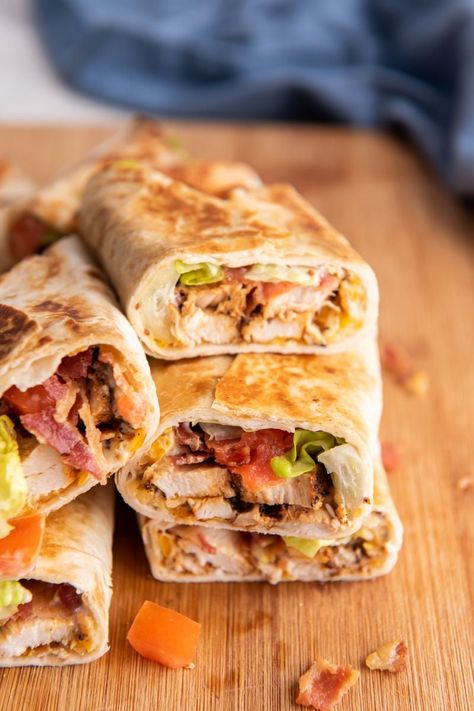 Whether you’re looking for a quick lunch or a craveworthy dinner, this chicken bacon wrap is guaranteed to hit the spot! Melty cheese and a mayo-mustard make it oh-so-satisfying. Chicken Bacon Ranch Wrap Air Fryer, Toasted Chicken Wrap, Chicken Bacon Wraps Tortilla, Crispy Chicken Bacon Ranch Wrap, Bacon Chicken Wrap, Chicken Bacon Ranch Wraps Recipes, Cheese Burger Wraps, Chicken And Bacon Wraps, Honey Mustard Chicken Wrap