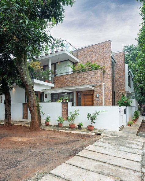 Twin Courtyard House by ID+AS Architects Courtyard House Front Elevation, Twin Bunglow Elevation Design, Large Balcony, Dark Color Palette, Puja Room, Internal Courtyard, Top Architects, Wooden Staircases, Courtyard House