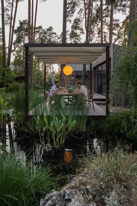 Summer Patio is situated in “Zapovedniy Bor” village estate in a natural reserve on former hunting grounds, close to Nerskaya river. The village is surrounded by a pine forest with clean air. All of the houses are built of wood, which correlates with lovely ecological environment of the location. #architecture #architect #amazingarchitecture #design #interiordesign #interiordesigner #decor #homedecor #home #house #luxury #diy #travel #amazing #photography #realestate #casa #arquitecto Forest Design Landscape, Forest Architecture, Ecological Garden, Ecological Architecture, Forest Cabins, Dream House Garden, Garden Ponds, Outdoor Sitting Area, Forest Cabin