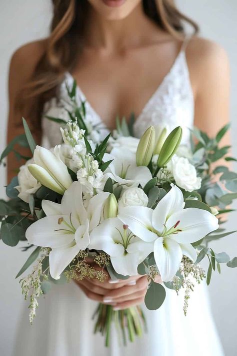 30 Beautiful Lily Bouquets For Your Big Day • White Lily Floral Arrangements, White Lilies And Roses Bouquet, Bride Bouquets With Eucalyptus, White Lily Bridal Bouquet, Tropical White Bridal Bouquet, Lillies Bouquet White, Lily Bridal Bouquet White, Bouquet Of Flowers For Bride, Lillies Wedding Flowers