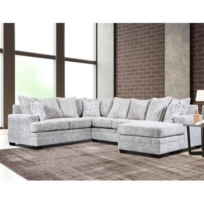 Helaina Fabric Sectional is a stylish and modern piece of furniture that will add a touch of sophistication and luxury to any living space. The sleek lines and neutral colors of the charcoal grey fabric create a timeless look that complements any home décor. The firm cushions and wide seating area provide comfort and support, making this sectional perfect for lounging. The high-quality materials and construction ensure durability and longevity. This sectional is a great addition to any home and Silver Throw Pillows, Upholstered Chaise, Grey Sectional, Fabric Sectional, 3 Piece Sectional, Exclusive Furniture, Sectional Sofas, Mattress Springs, Spacious Living Room