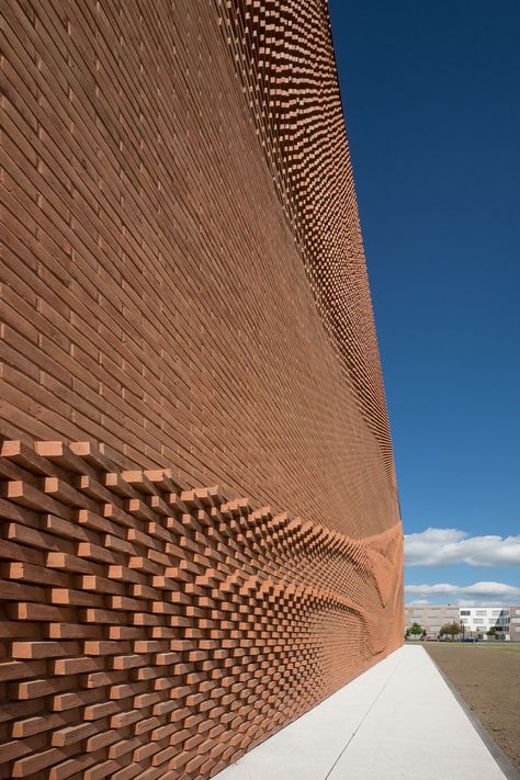 An Undulating Brick Facade Imitates the Free-Flowing Movement of Draped Fabric | Colossal Architecture Renovation, Brick Works, German Architecture, Brick Cladding, Brick Detail, Brick Art, Brick Texture, Brick Architecture, Brick Facade