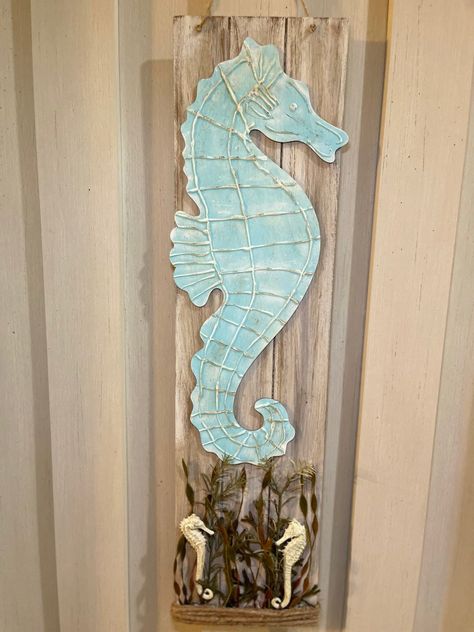 A detailed seahorse sign DIY using a dollar tree board sign, wood shore living seahorse, hot glue and shore living seahorse greenery. Seahorse Aesthetic, Beachy Signs, Dollar Tree Diys, Driftwood Fish, Baby Dresser, Burlap Canvas, Watch Diy, Turtle Decor, Tree Signs