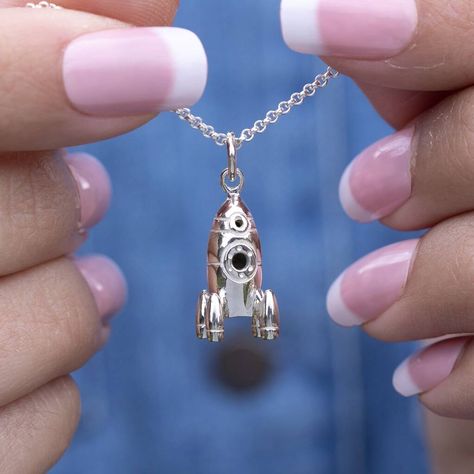 Our stunningly detailed rocket necklace will be sure to create a blast! Crafted from sterling silver this three-dimensional spacecraft charm has been hand-finished for a polished shine and makes a truly unique design to add to our celestial jewellery collection. The ideal gift for any astronomer, sci-fi enthusiast or budding rocket man or astronaut each space rocket charm features retro styling with an oval shaped body with two round porthole windows and hammered metal panel detailing. Ready to Spaceship Necklace, Moon Accessories, Open Circle Necklace, Rocket Man, Karma Necklace, Horoscope Necklace, Space Rocket, Elephant Bracelet, Silver Elephants