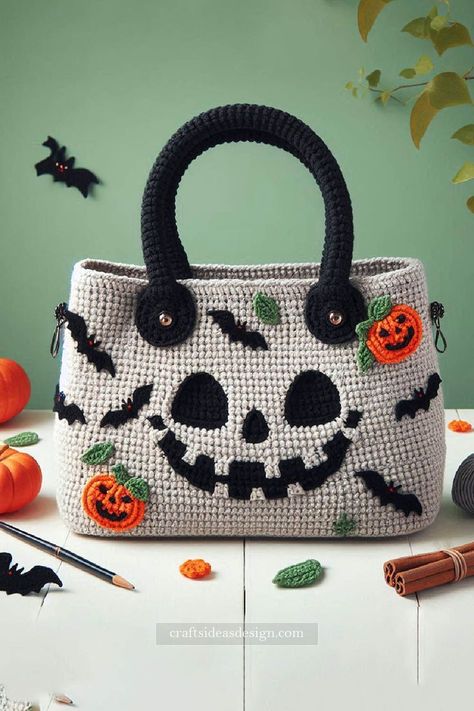 Halloween Crochet Bag is the perfect accessory to showcase your festive spirit while staying stylish. This charming bag features a delightful mix of Halloween-themed appliqués, including pumpkins, bats, and a spooky smiling face. Crochet Bag With Compartments, Pumpkin Purse Crochet, Pumpkin Crochet Bag, Crochet Halloween Cardigan, Crochet Halloween Bag, Crochet Handbag Patterns Free, Crochet Halloween Patterns, Crocheted Purses, Halloween Amigurumi